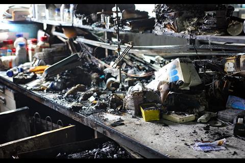 A picture showing the interior burnt mess on a lab surface